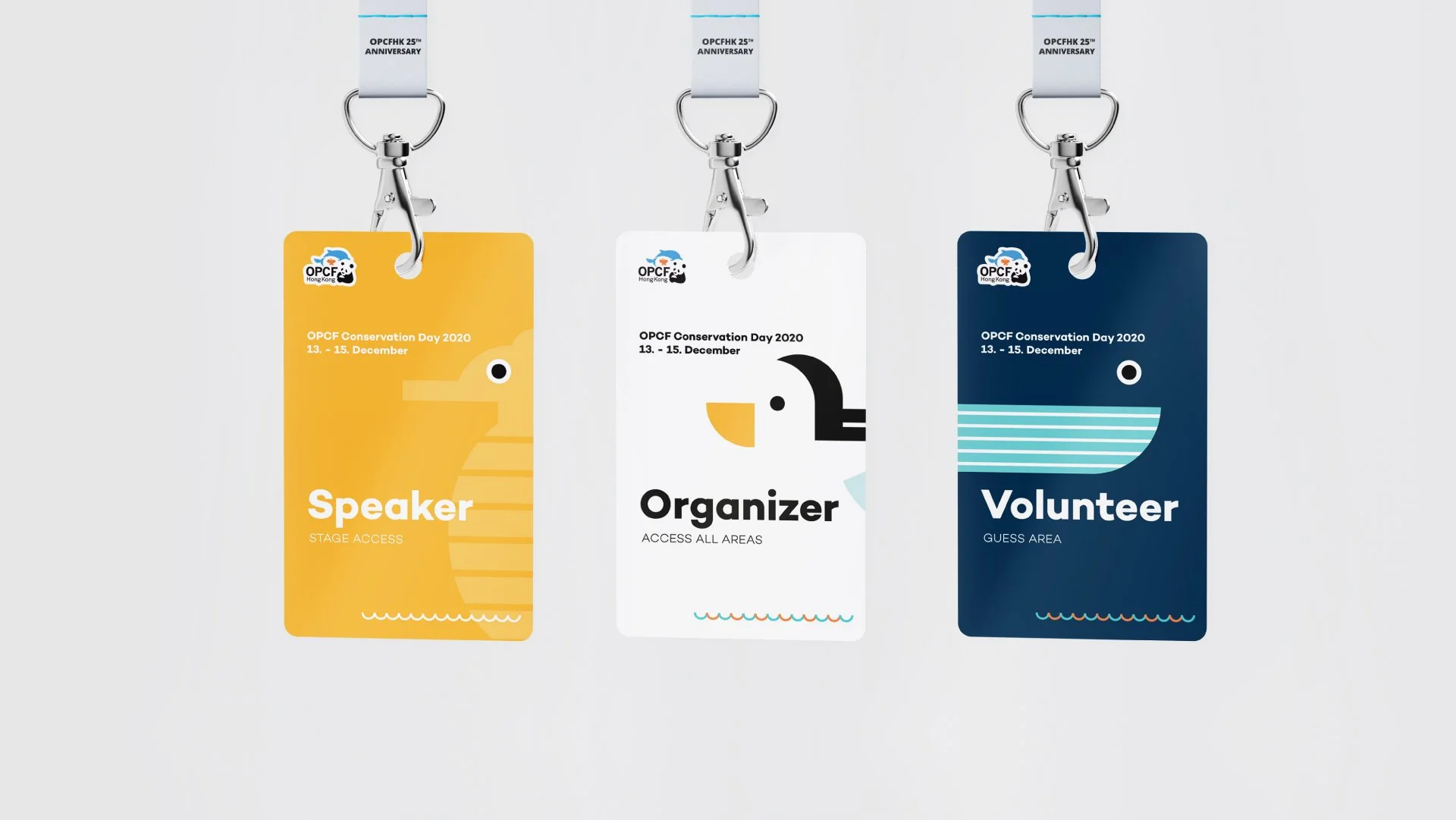 Three event badges hanging on lanyards for OPCF Conservation Day 2020, December 13-15, with a yellow badge for speakers, a white badge for organizers, and a dark blue badge for volunteers, each featuring cartoon animal illustrations.