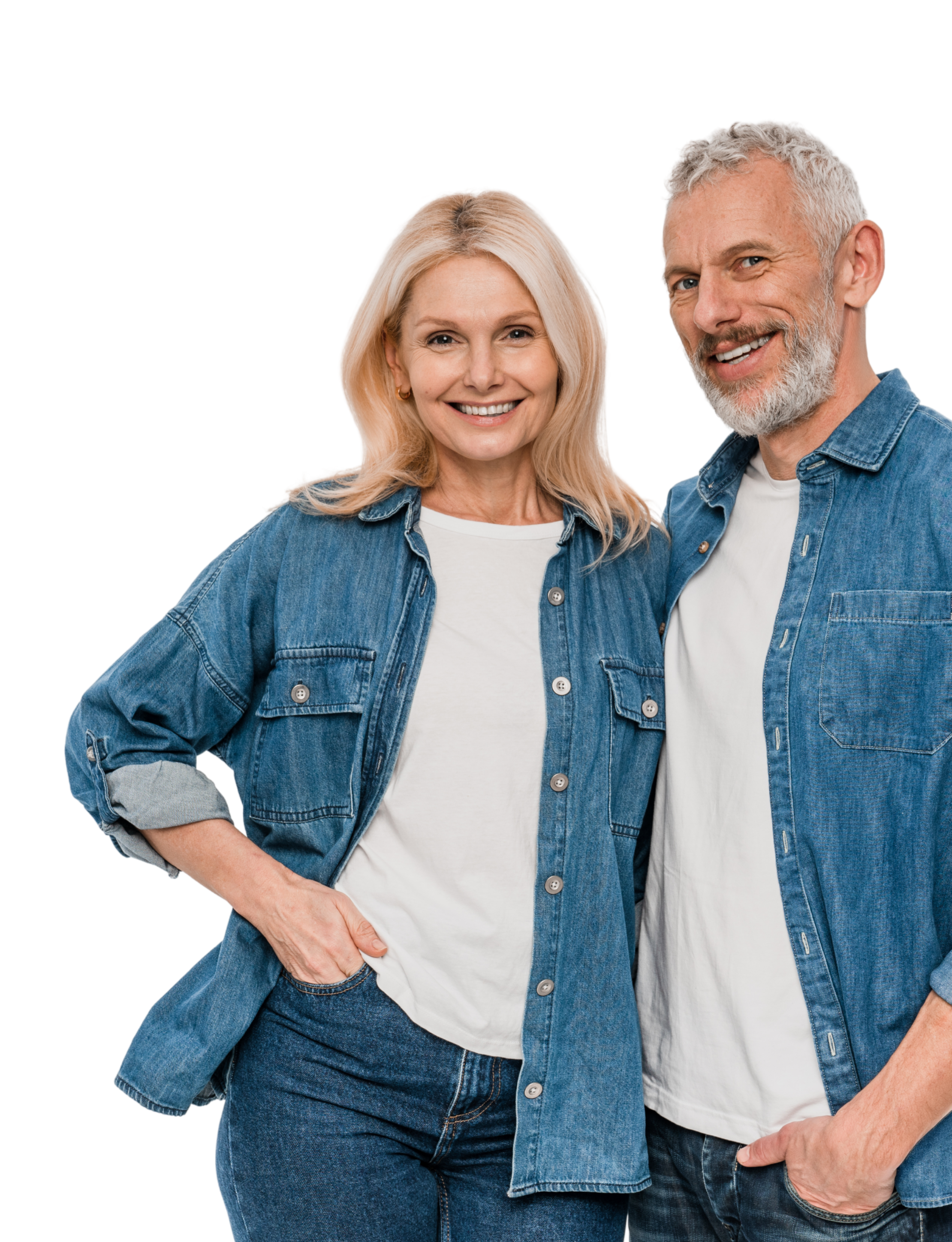 A smiling middle-aged couple with blonde hair, dressed in casual denim outfits, standing close together against a black background.