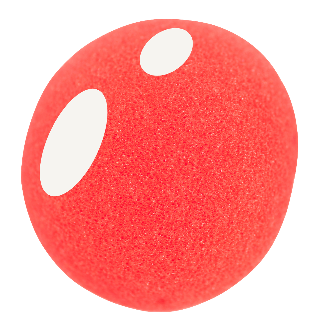Close-up of a red foam clown nose.