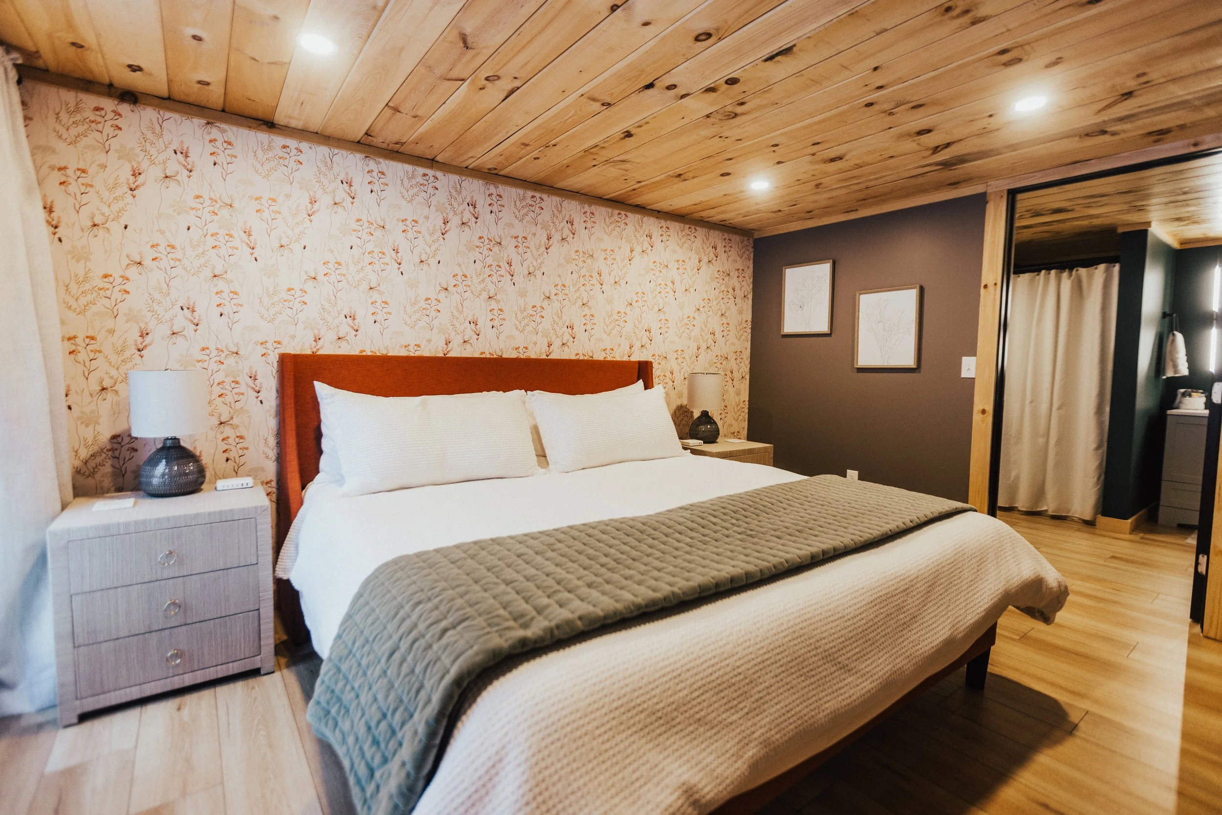 BEDROOM 3: The Fox Den Suite ~  Tuck in to the private primary suite with king bed, attached bath, and french doors that lead out to the backyard