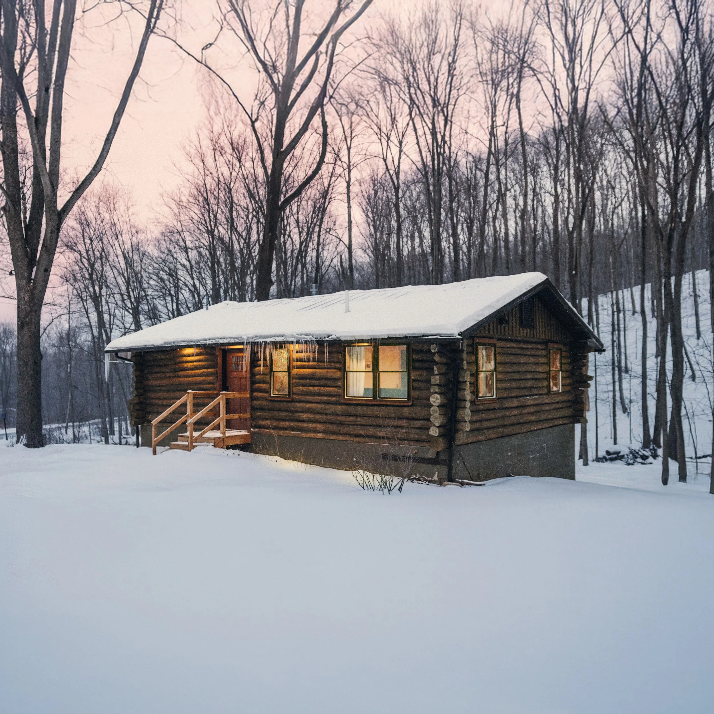 LOG CABIN CHARM ~ 
Situated on quiet winding road with four private acres and a beautiful view of nature