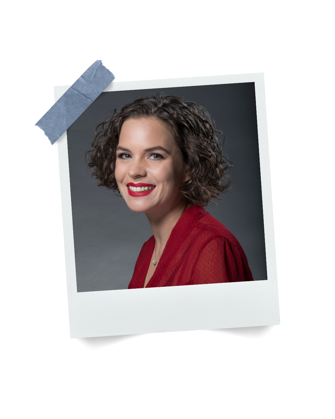 A photo of Lucy Veale - Co-President at Bizable - Polaroid-style with curly brown hair, wearing a red blouse, smiling against a gray background.