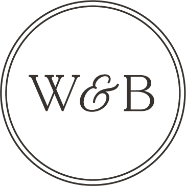 A black circular logo with the text "W & B" in the center.