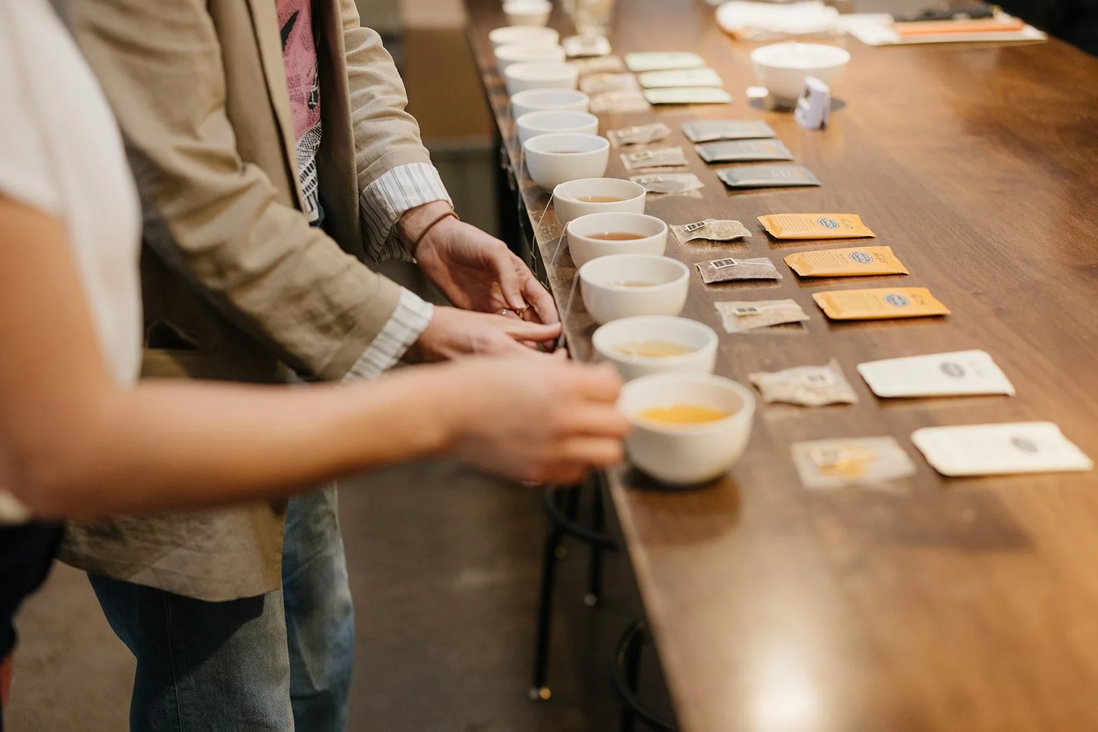 cups of tea, teabags, hands