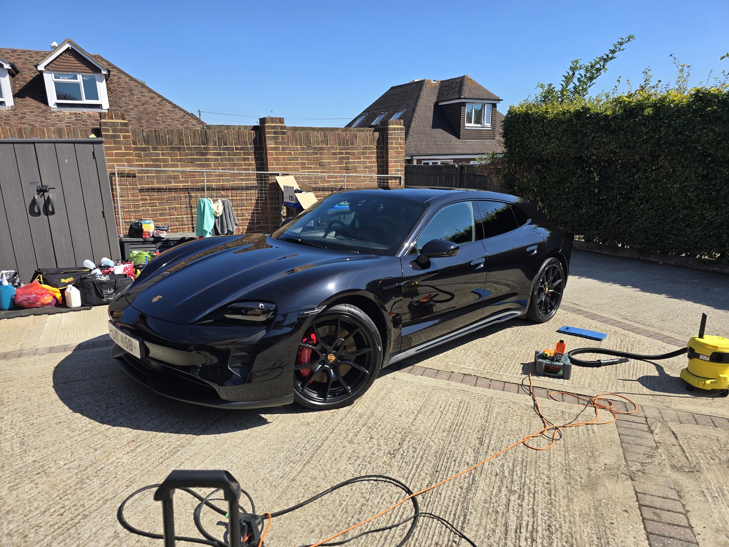 Porsche Taycan following a maintenance wash.