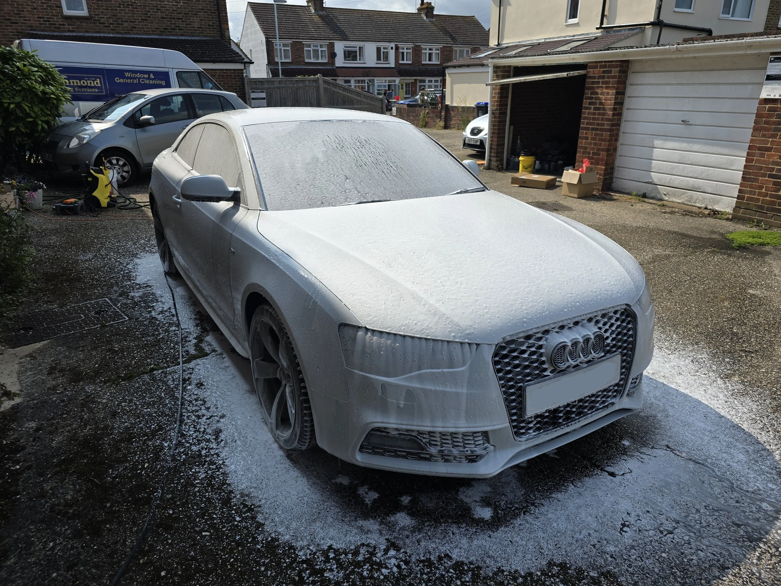 Audi A5 covered in snow foam as part of its full valet.