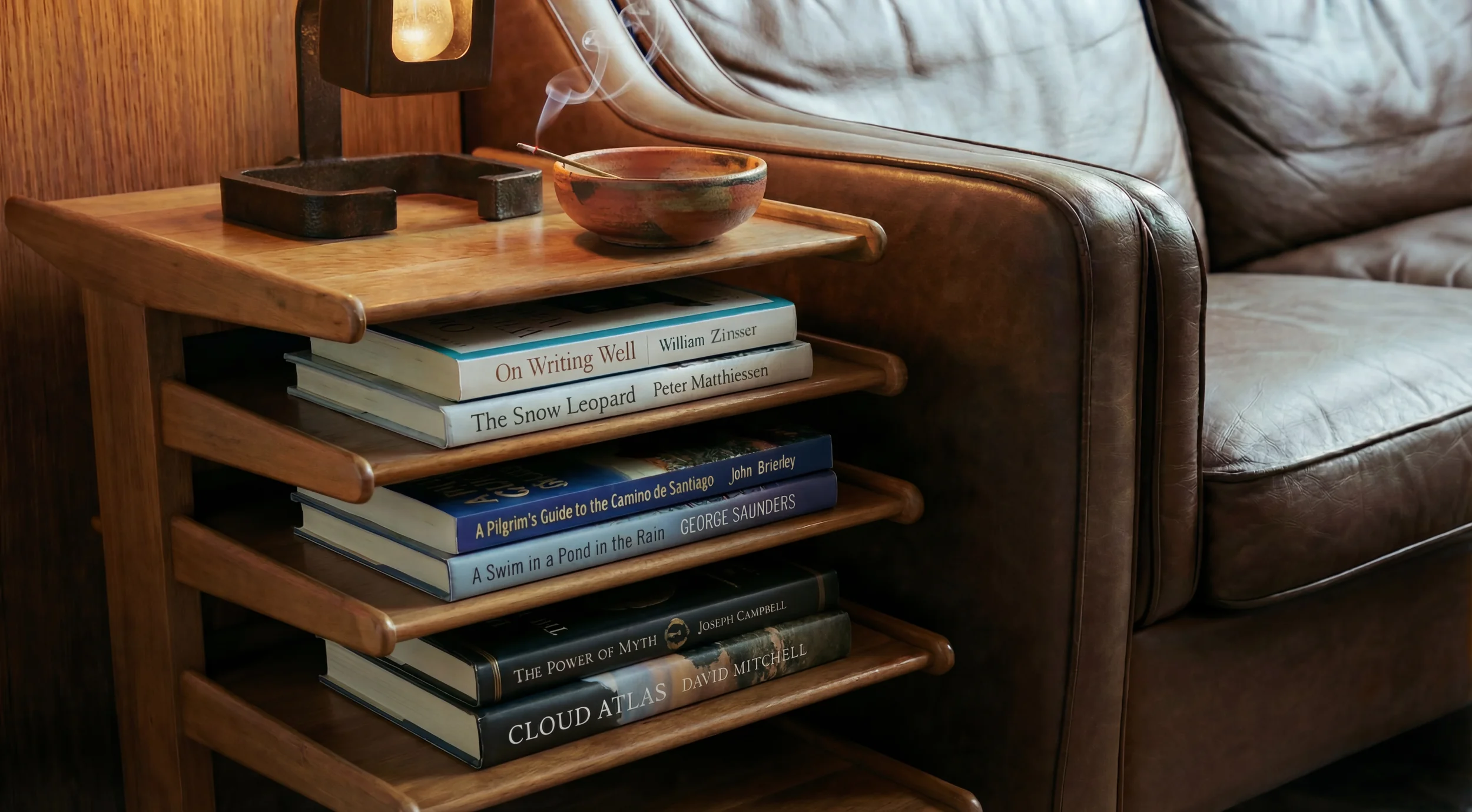 Books and a quiet workspace evoking the editorial environment at Waymark Comms