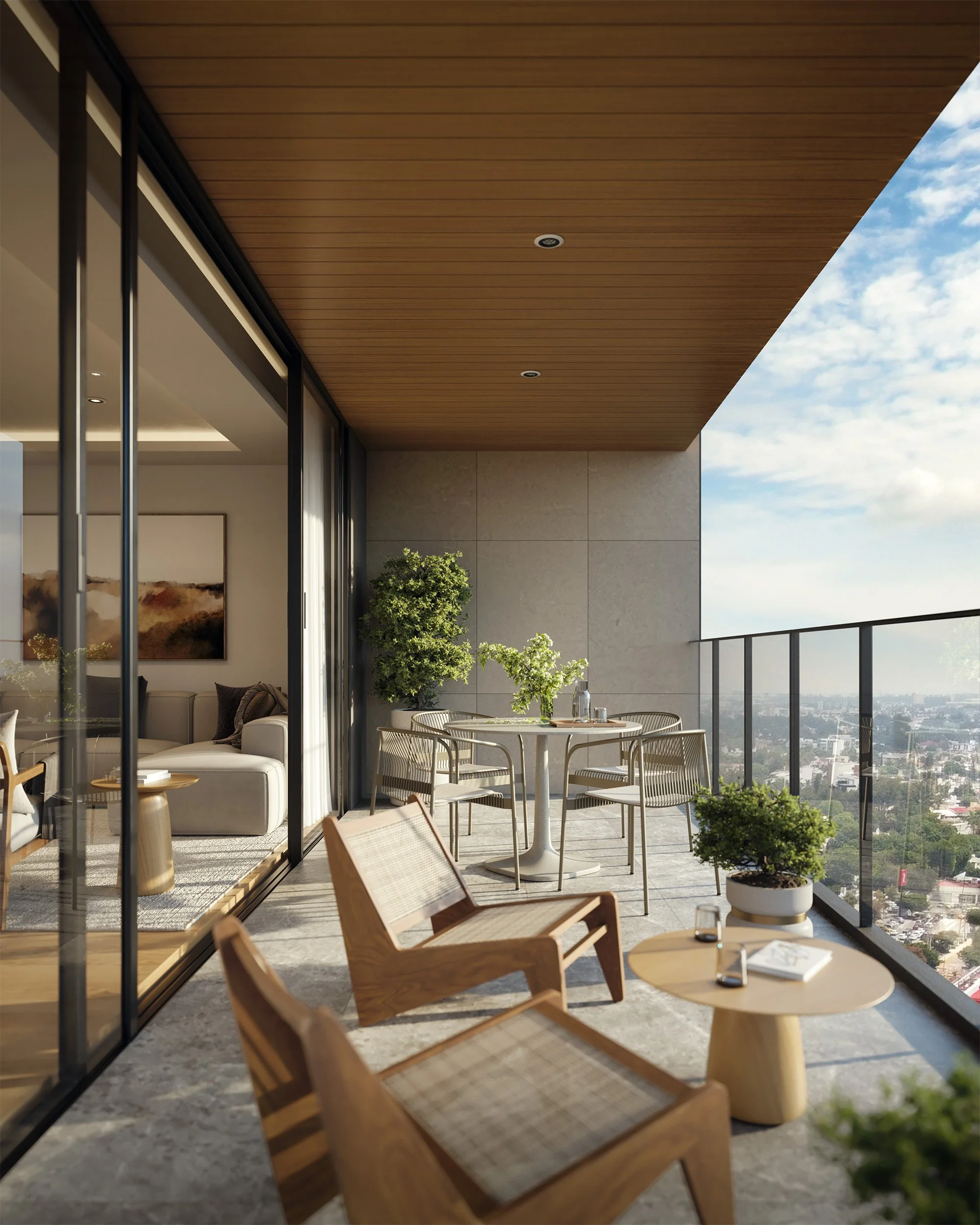 Balcón de apartamento con mesa, sillas, plantas y vista de la ciudad