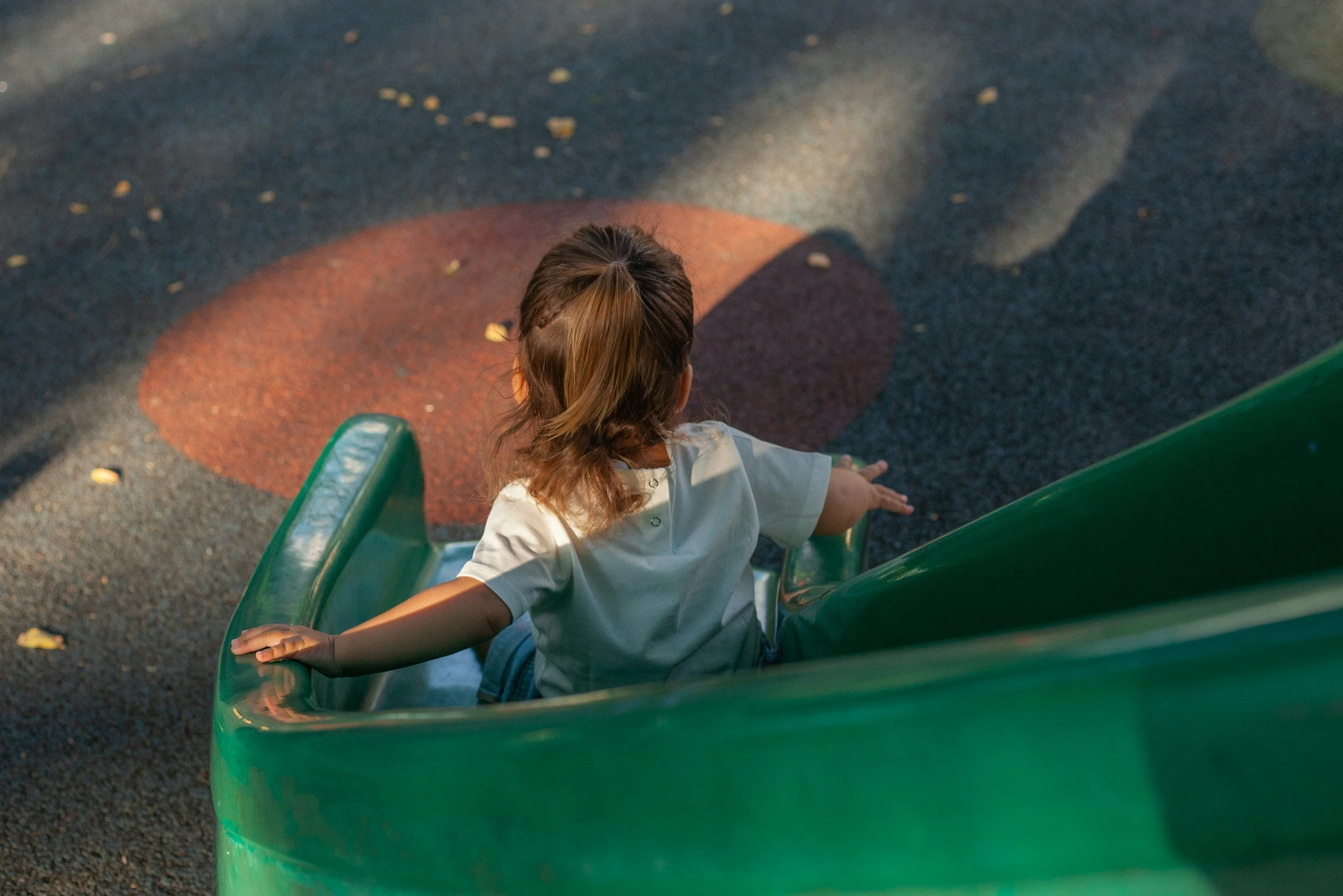 Child playing on playground during behavior therapy session in Charlottesville VA