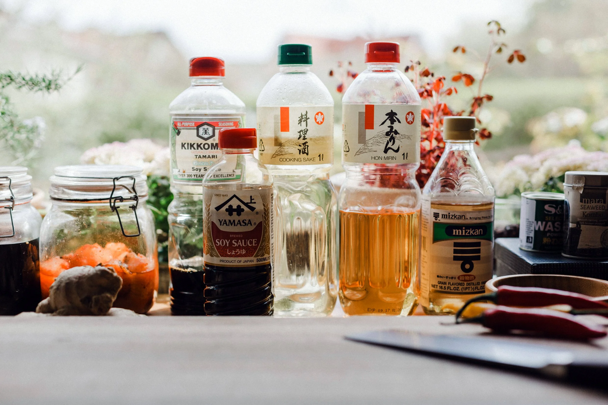 Ingredients for homemade Japanese ponzu sauce, including soy sauce, mirin and rice vinegar
