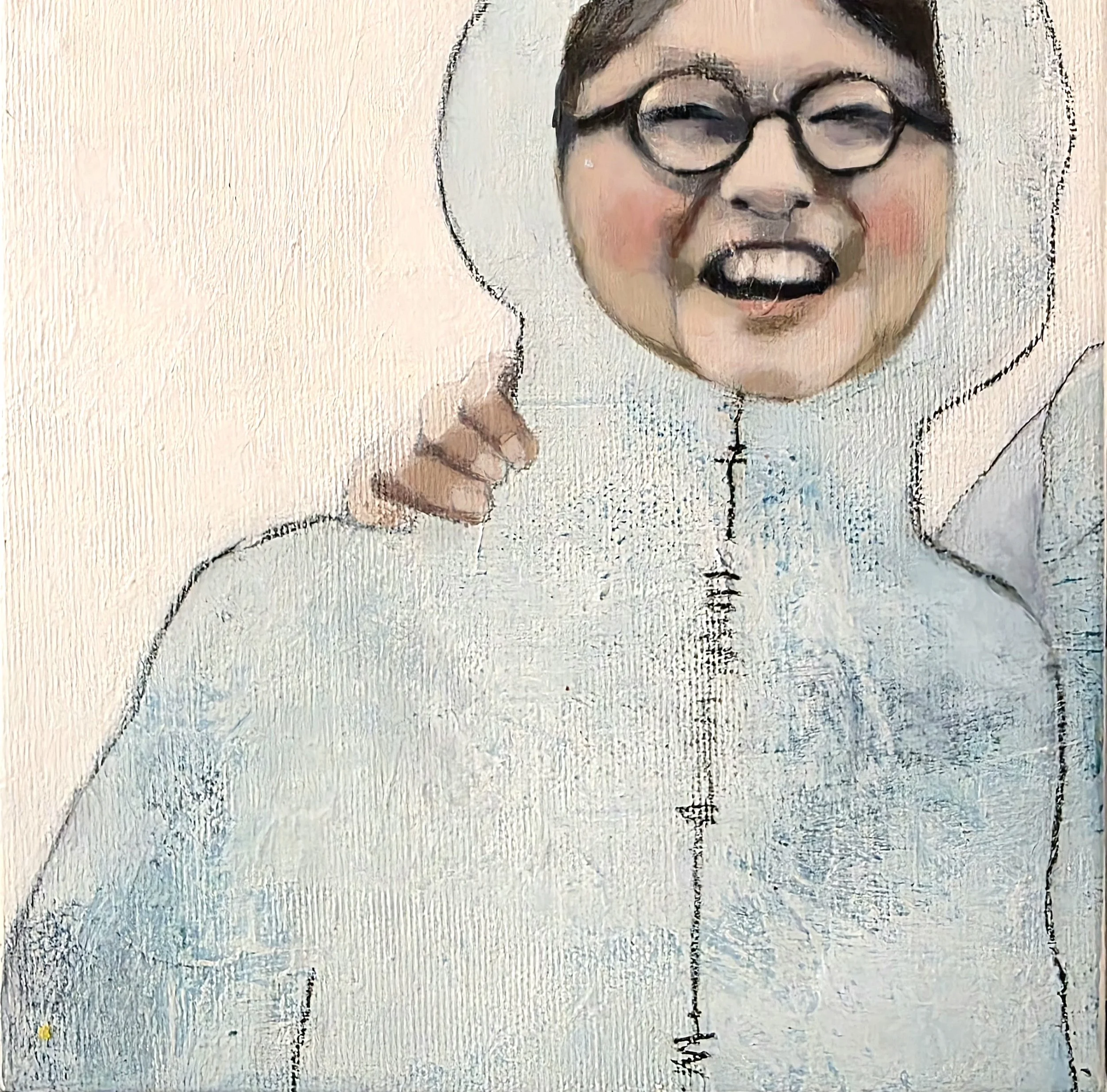 A person in a white costume with a hood and zipper, holding a mirror with a laughing face reflection with glasses.