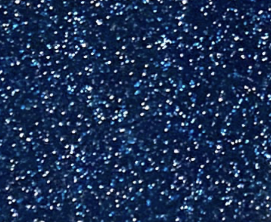 Close-up of a dark blue, glittery surface with numerous shiny specks reflecting light.