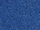 Close-up of a blue glittery surface with sparkling particles.