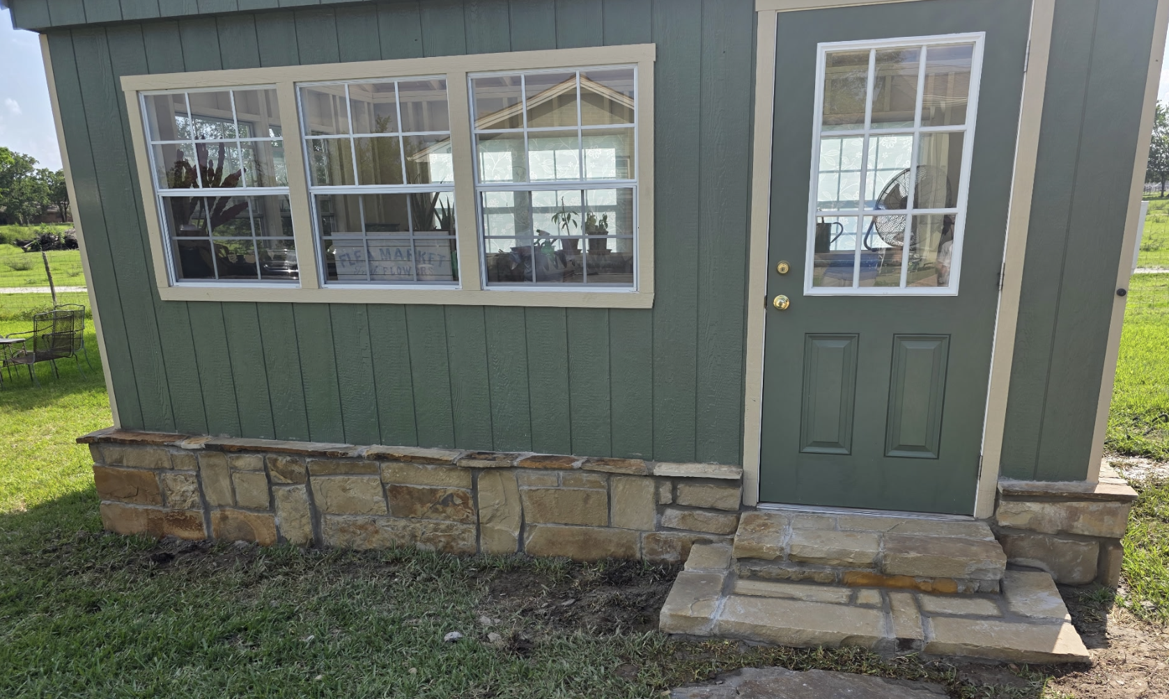 Adding stonework and stairs to enhance the appeal of a greenhouse!