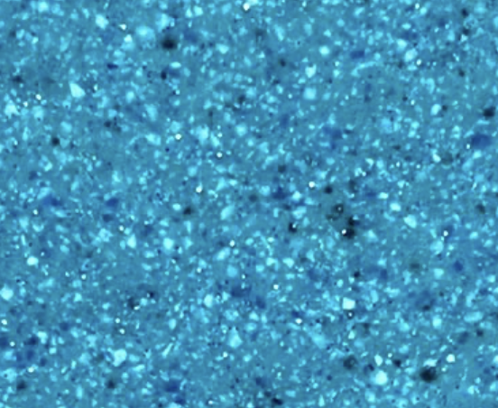 Close-up of a glittery, blue textured surface.