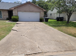 The before picture of a BCS Home that was in need of a new driveway!
