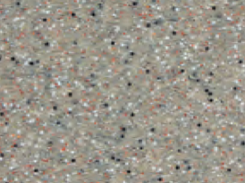 Close-up of a speckled, textured surface with various small, colorful particles.