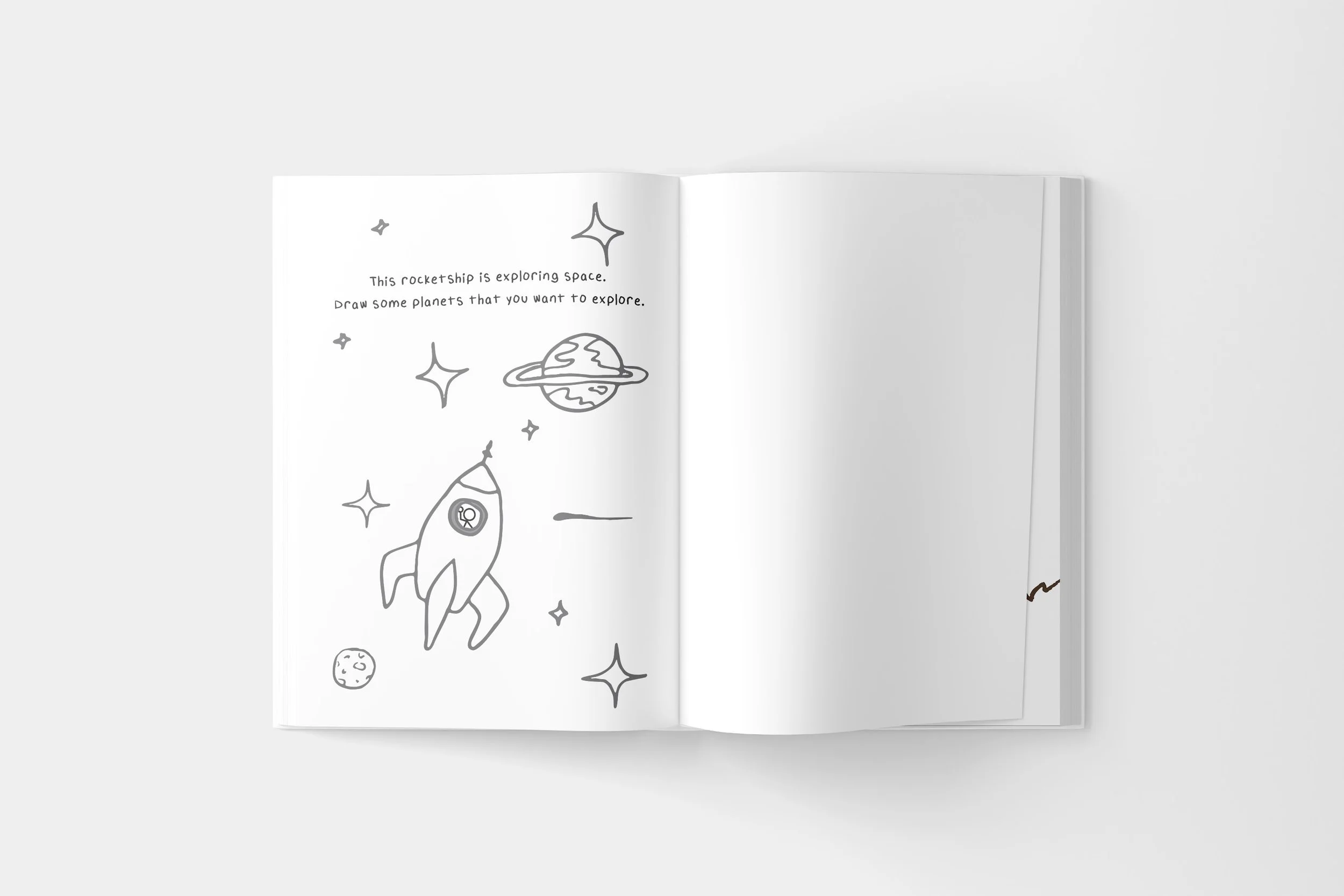 Open coloring book with space-themed drawings, including a rocket, stars, an alien planet, and a planet with rings, with text encouraging space exploration to draw planets.