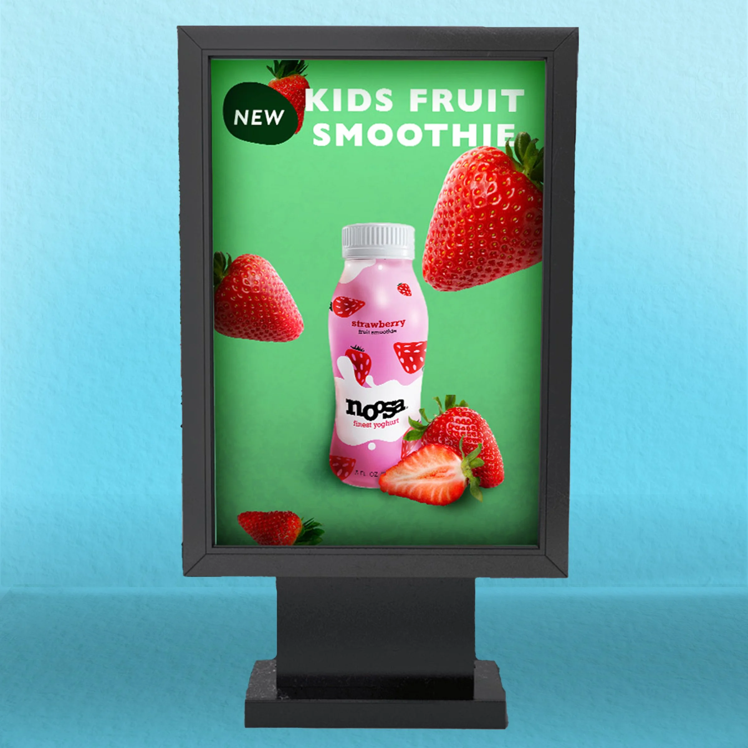 Digital advertisement for kids strawberry fruit smoothie featuring a pink bottle with strawberries and whole strawberries around it, with a green background.