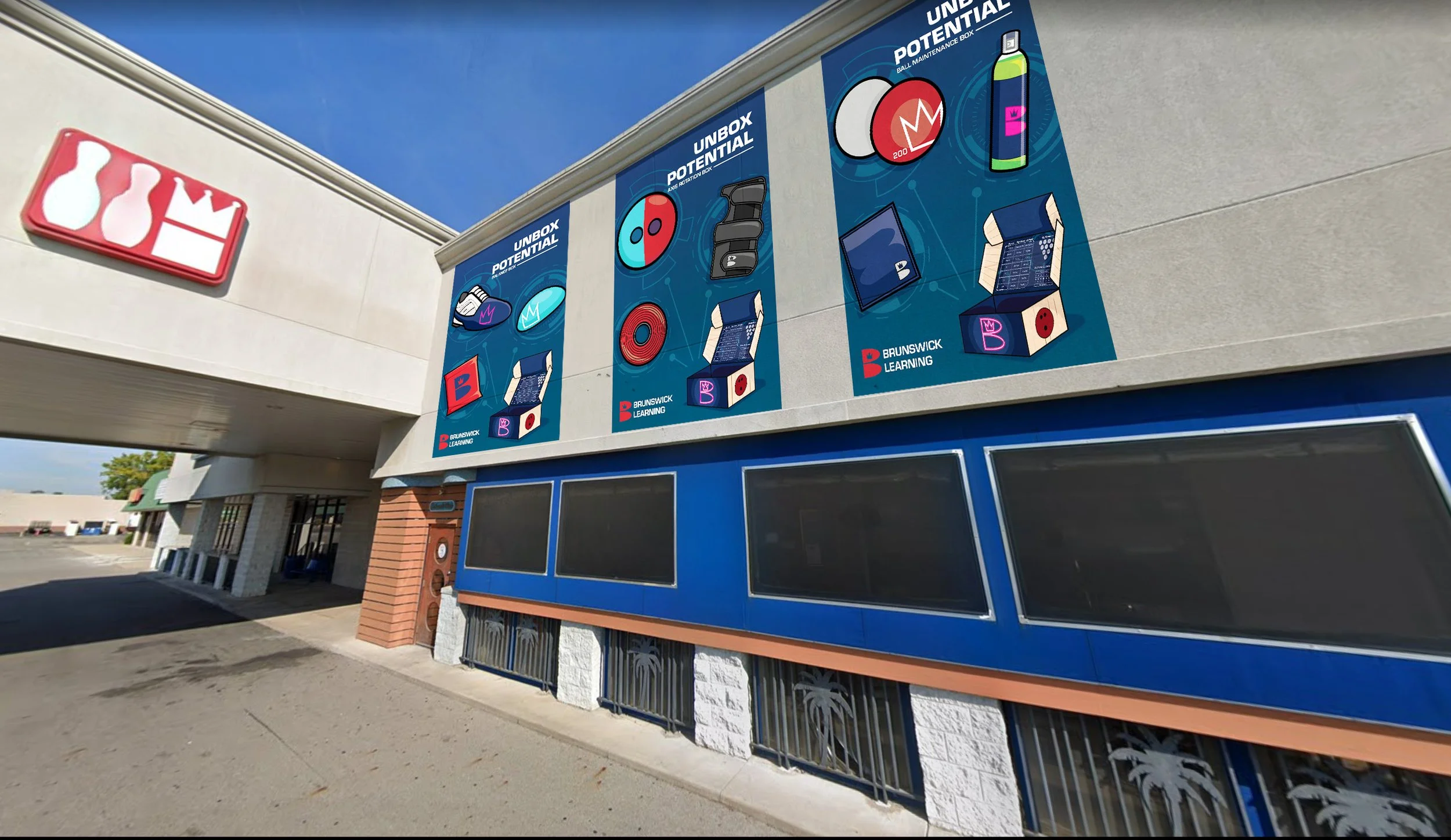 Large outdoor advertising banners featuring educational kits by Brunswick Learning, with illustrations of various learning tools such as globes, dice, and electronic devices, on the side of a building.