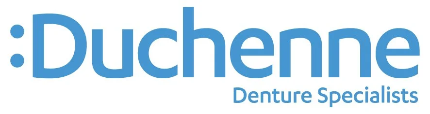 Duchenne Denture Specialists logo with blue text and a colon symbol.