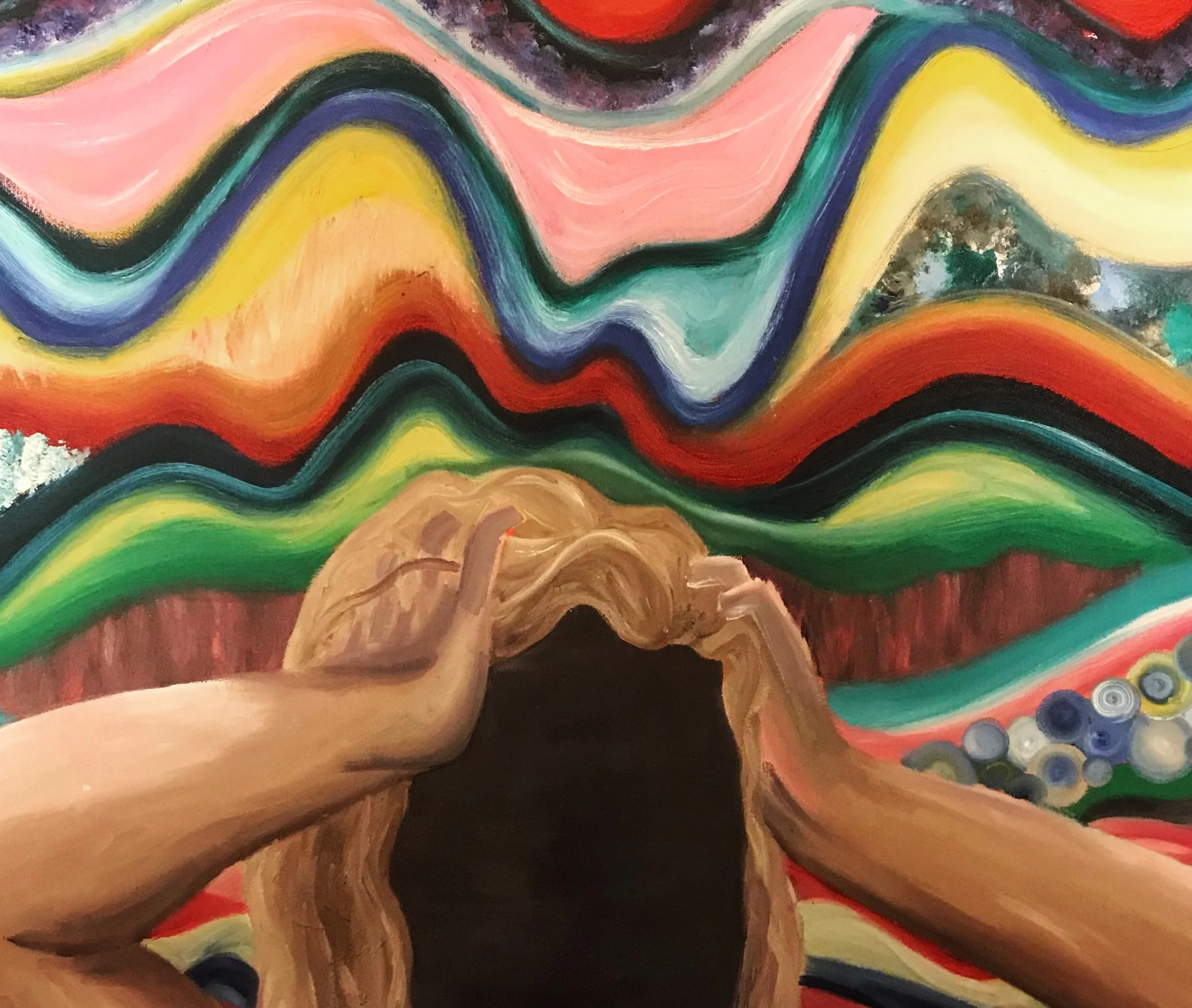 Close-up view of a colorful abstract painting featuring swirling lines and vibrant colors including pink, orange, yellow, green, blue, and black.