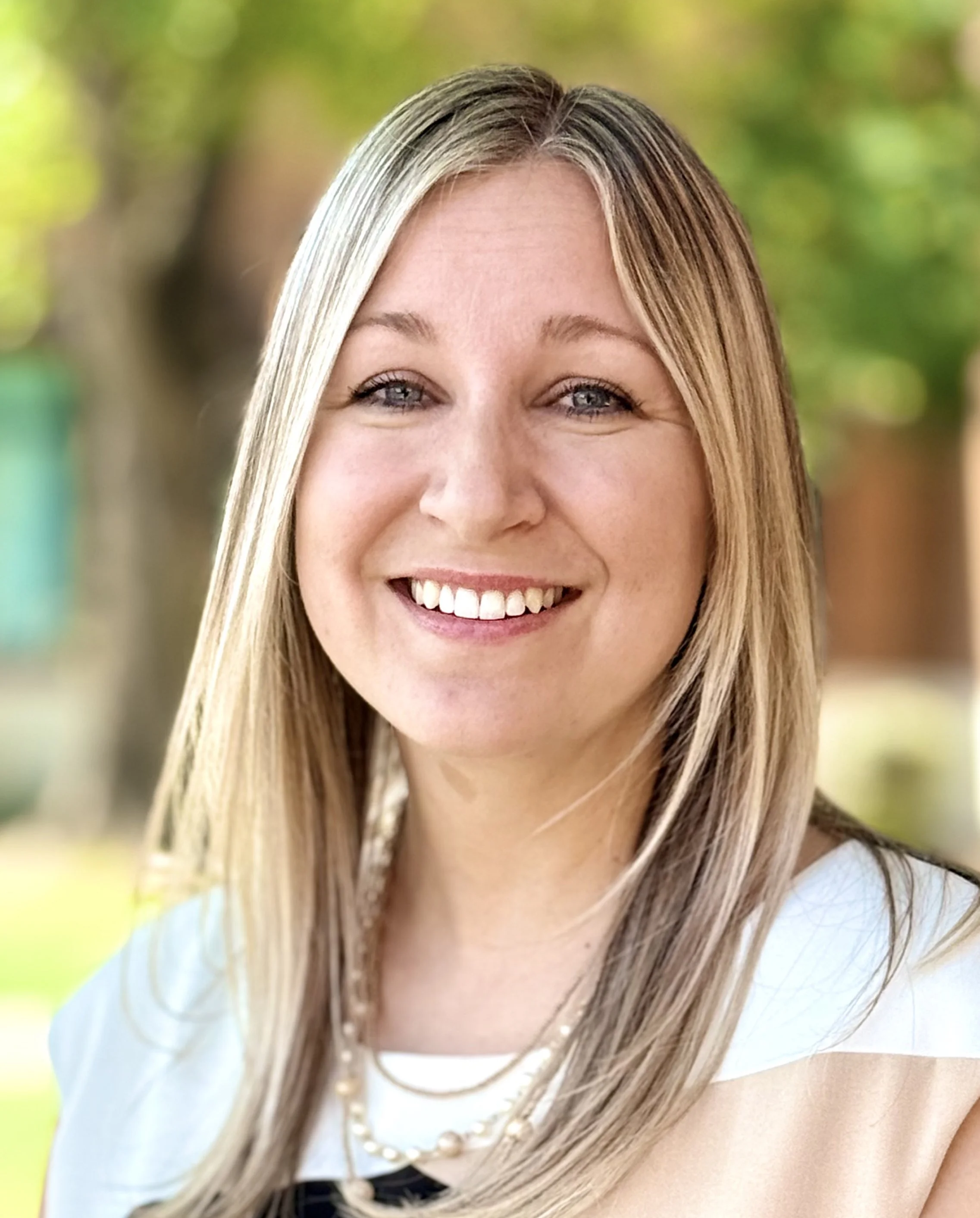 Heidi Tinkham, LAC, MSMFT, licensed counselor at Elizabeth and Associates, smiling in professional headshot for Chandler Arizona therapy practice