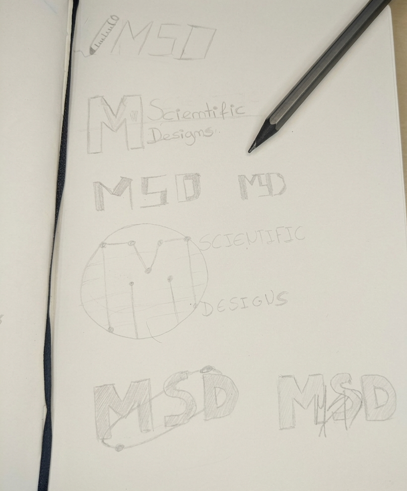 Sketchbook page with handwritten notes and drawings related to the name 'M.S.D'. The page includes the words 'Scientific Designs', various stylized text of 'M.S.D', and a circular diagram with labeled points.