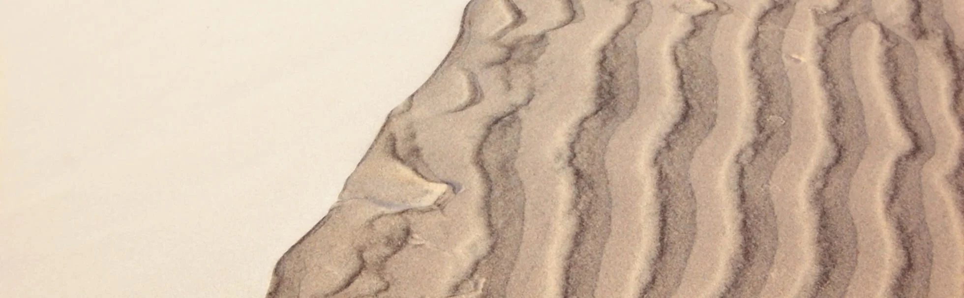 Close-up of a textured surface with wavy brown and beige patterns.