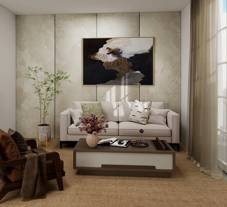 Living room with white sofa, abstract wall art, armchair, coffee table with flowers and books, tall potted plant, and large window with sheer curtains.