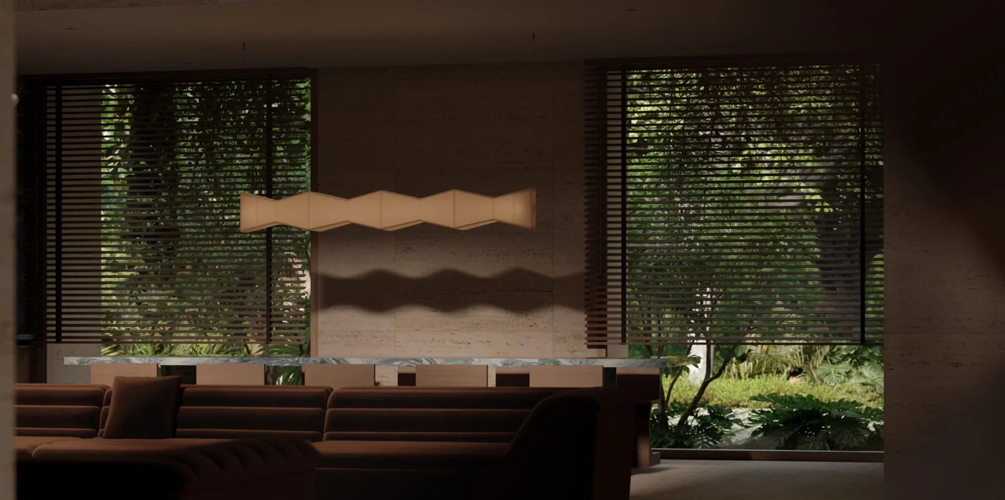 Interior view of a modern building with large windows and a decorative hanging light fixture, with greenery visible outside.