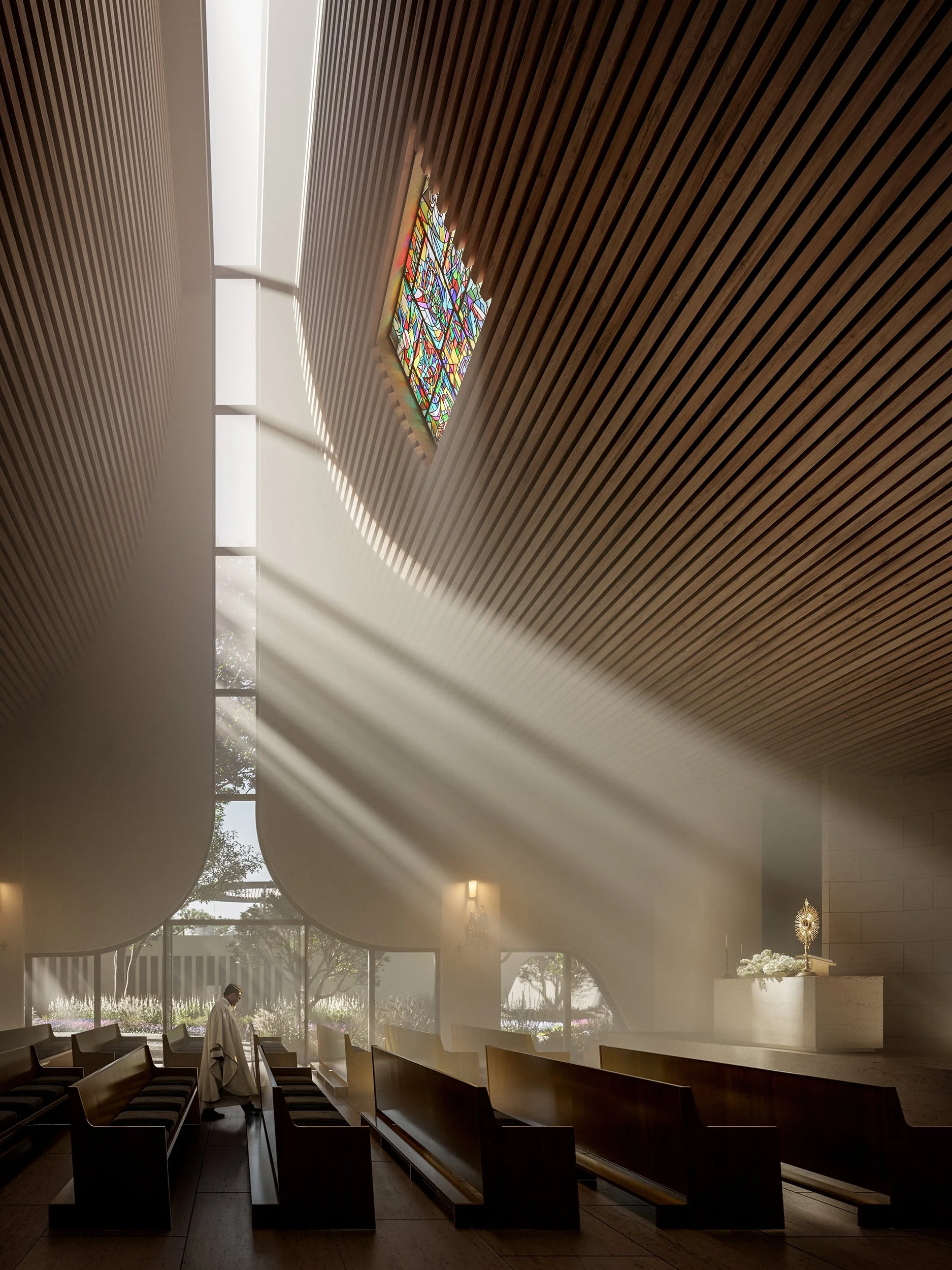 Interior of a church or chapel with wooden ceiling, stained glass window, and sunlight streaming through. A person dressed in white appears to be praying or standing near chairs.