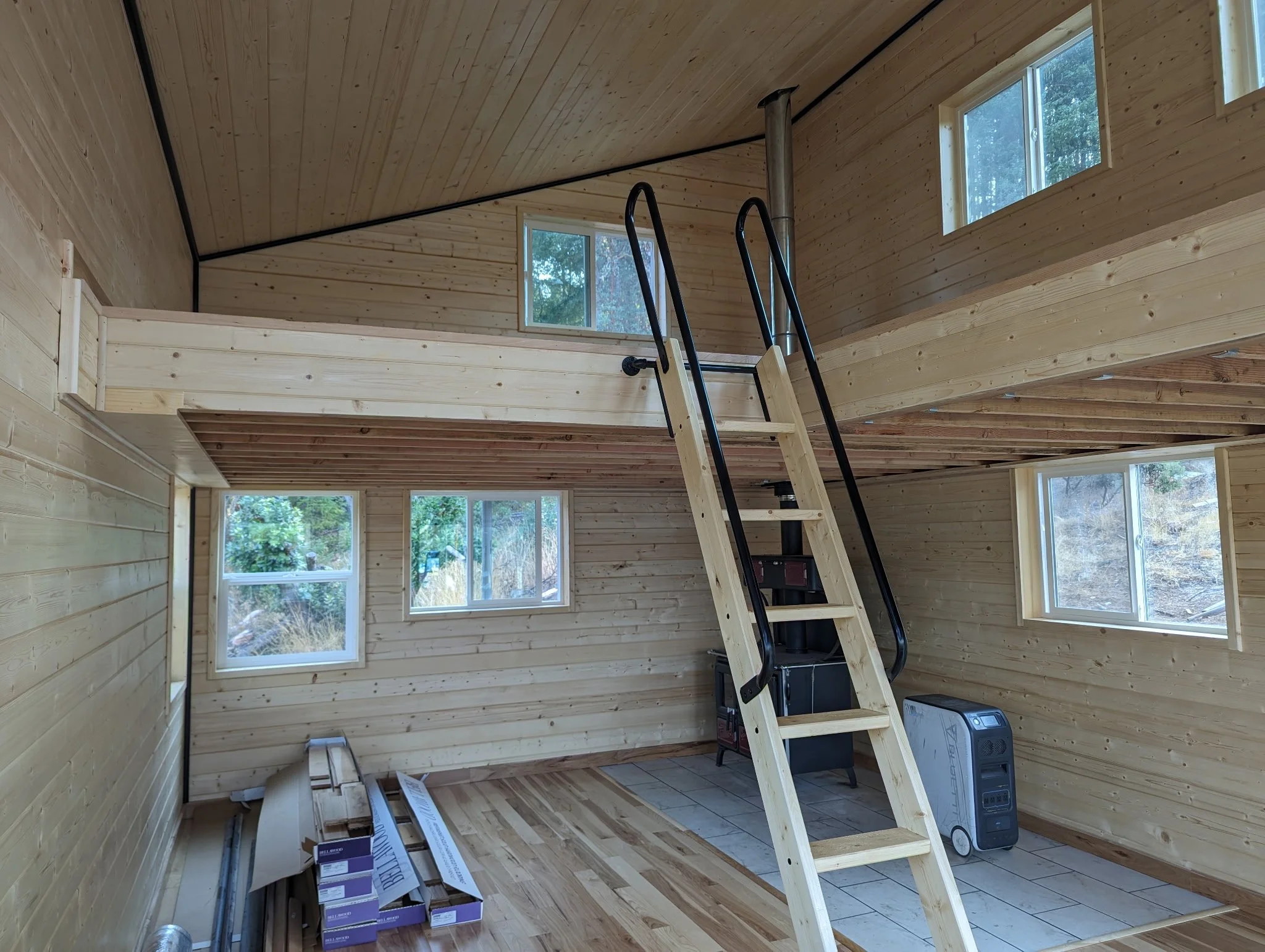 Tiny house interior with custom loft and stairs