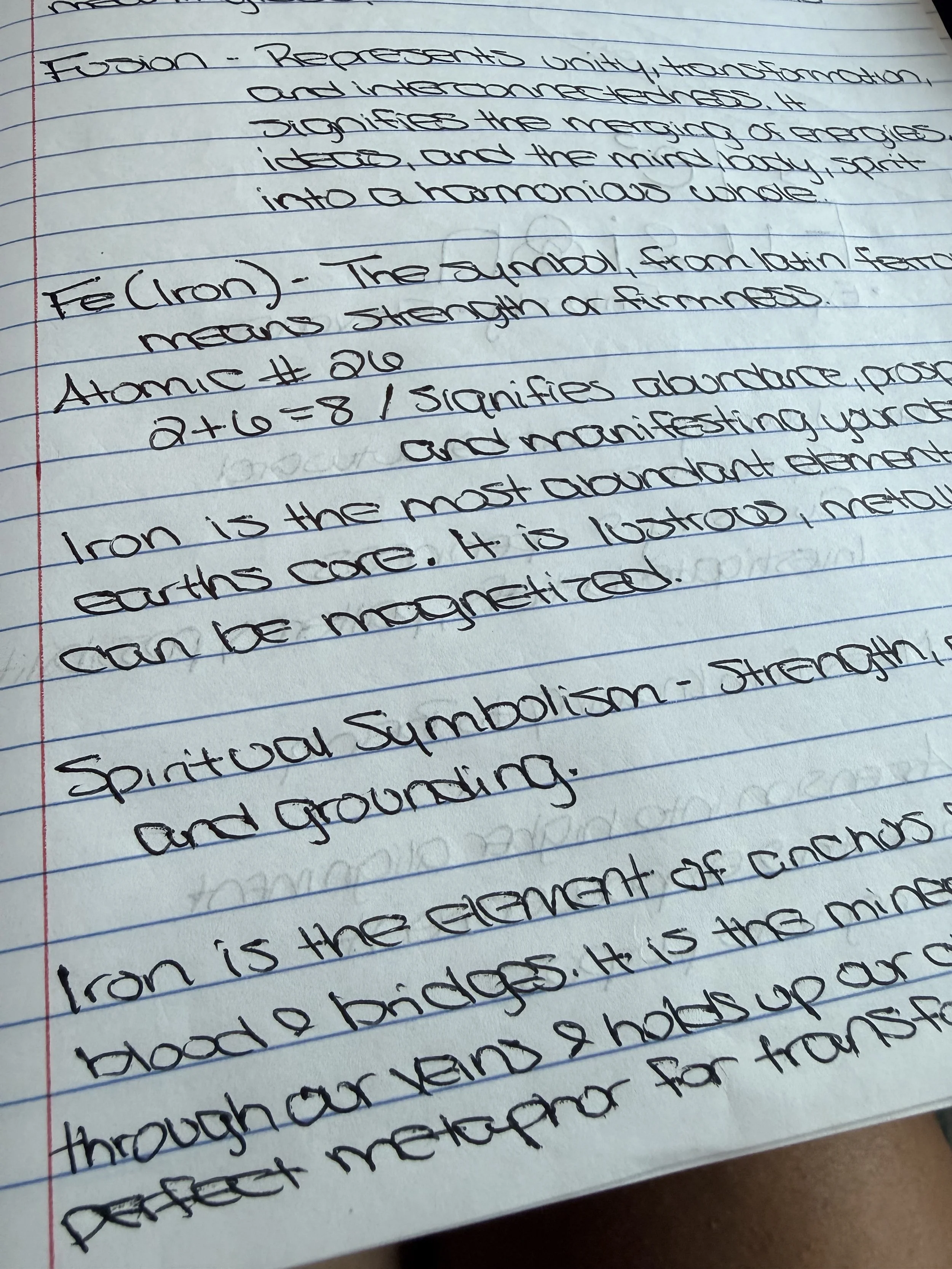 Handwritten notes on lined paper discussing the symbols of iron and fool's gold, their meanings, and their significance in spiritual and physical contexts.