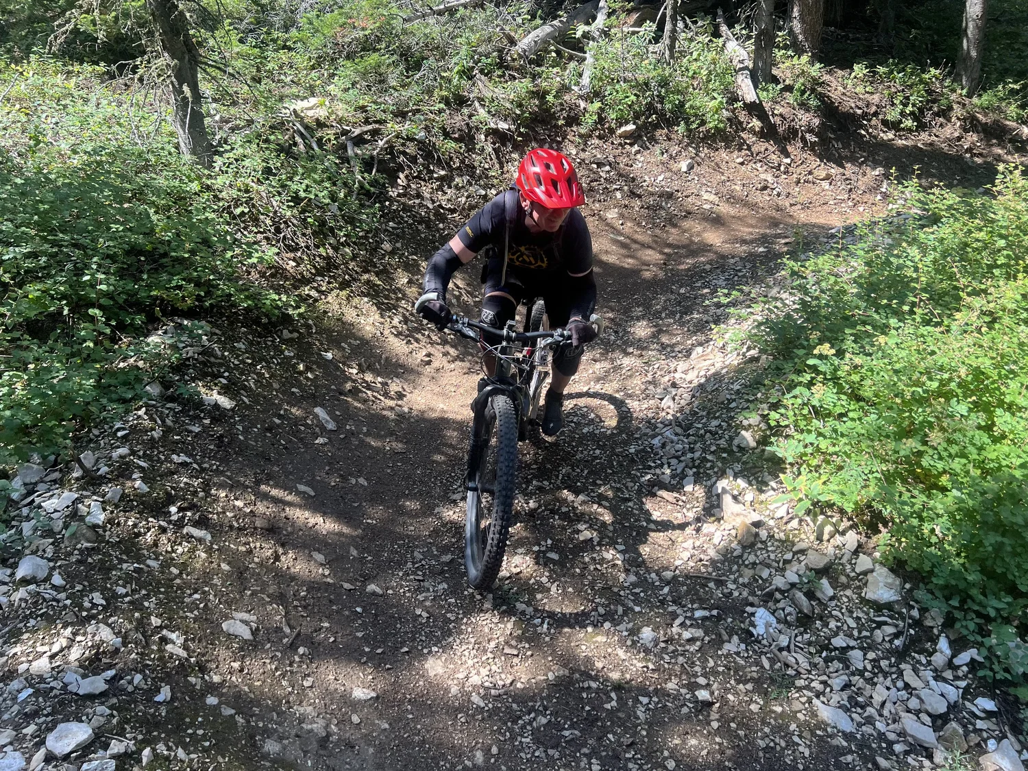 Darin coming down Let em Roll on the Red Grade trail system