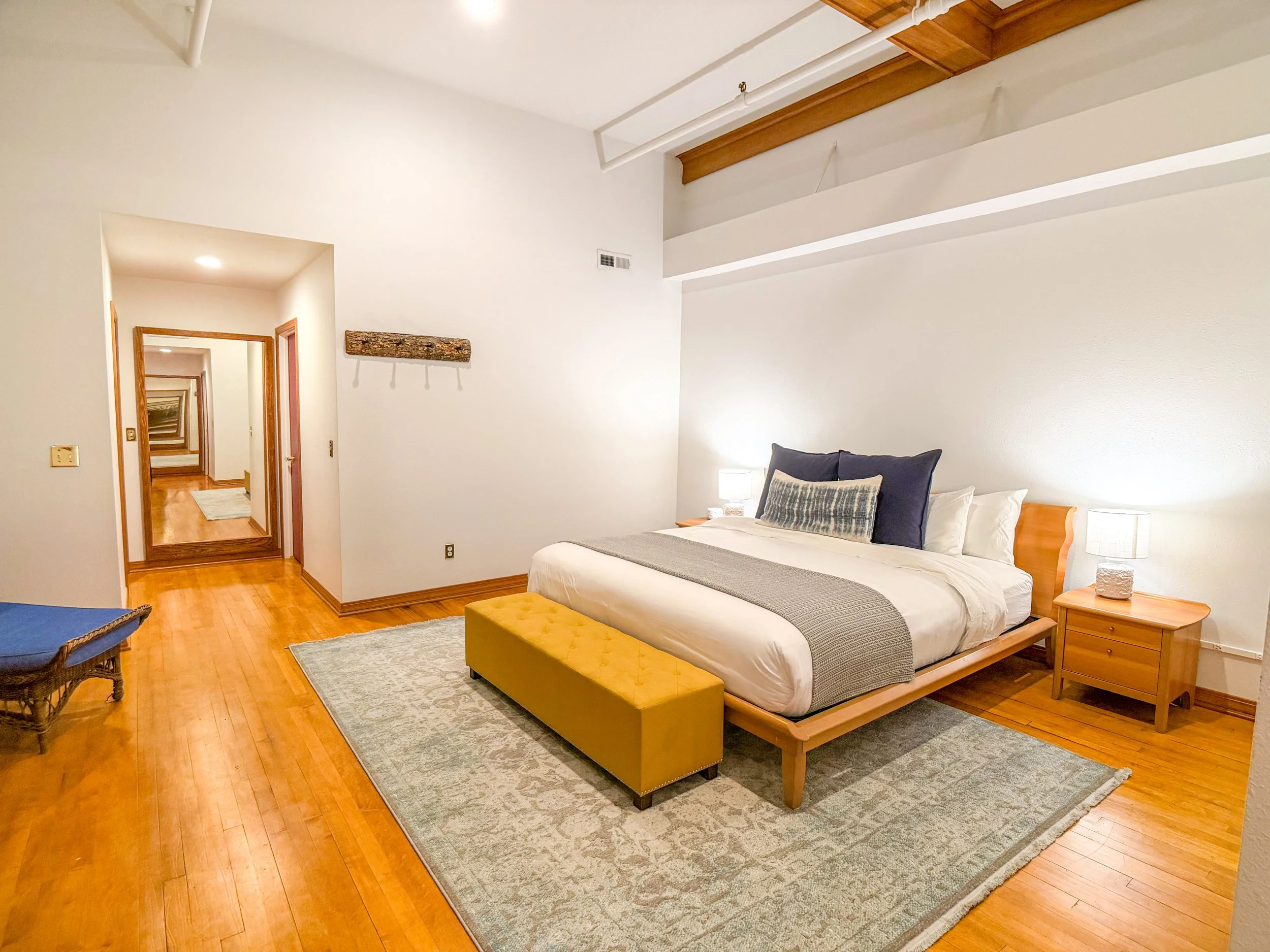 King bedroom at Late Checkout WY vacation rental Sheridan Wyoming — thoughtfully appointed with quality linens and warm finishes