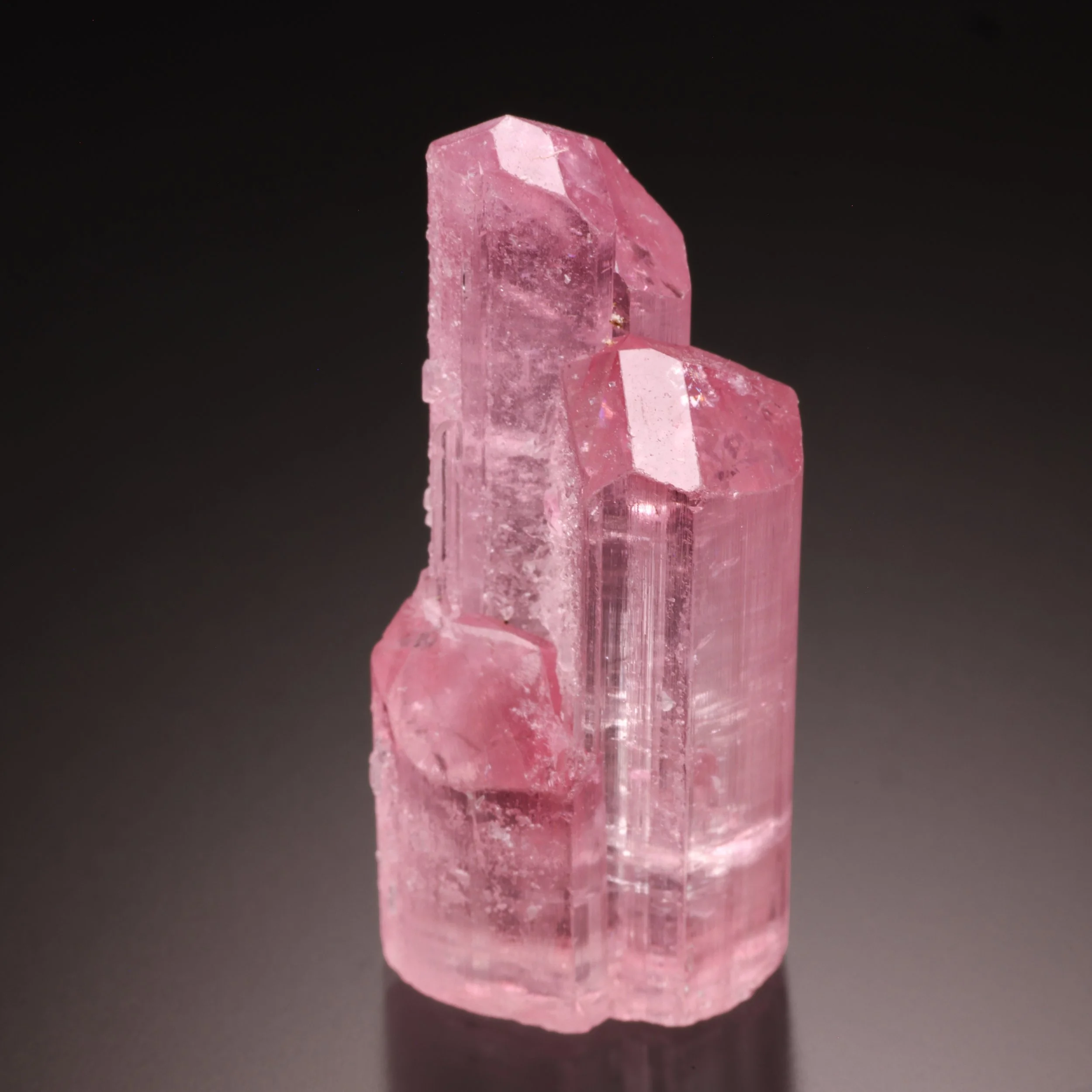 Pink tourmaline cluster on a dark background
