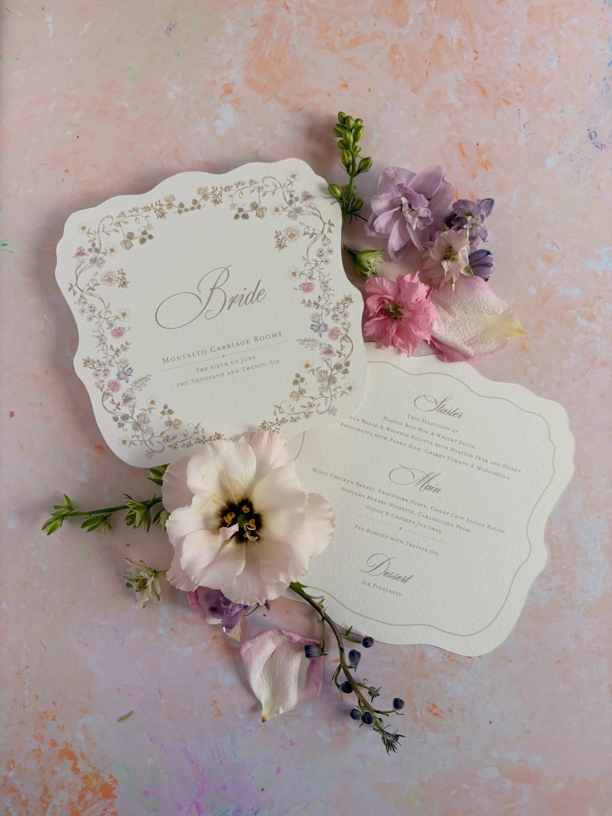 Okay but how dreamy are these soft pastel florals 😭✨

I had so much fun creating this bespoke wedding menu and stationery set. Delicate wildflowers, scalloped edges and all the romantic little details. I&rsquo;m such a sucker for textured cardstock 