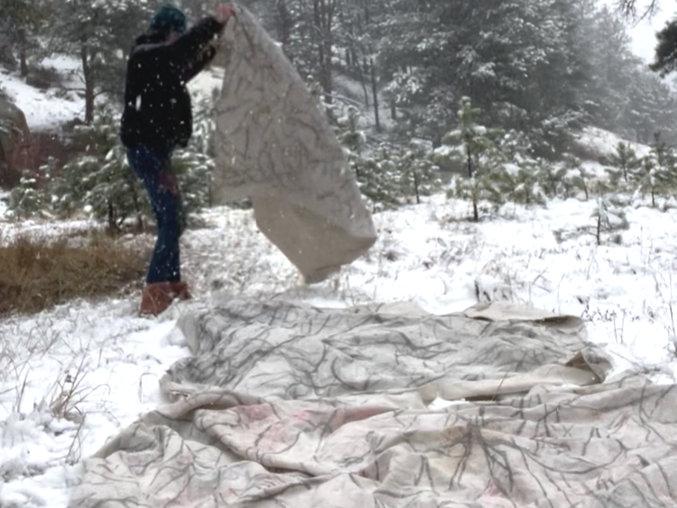 Canvas placed outdoors for burial and exposure to winter weather.