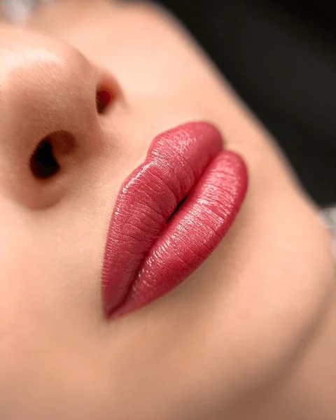 closeup-female-lips-after-permanent-600nw-2557644401.webp