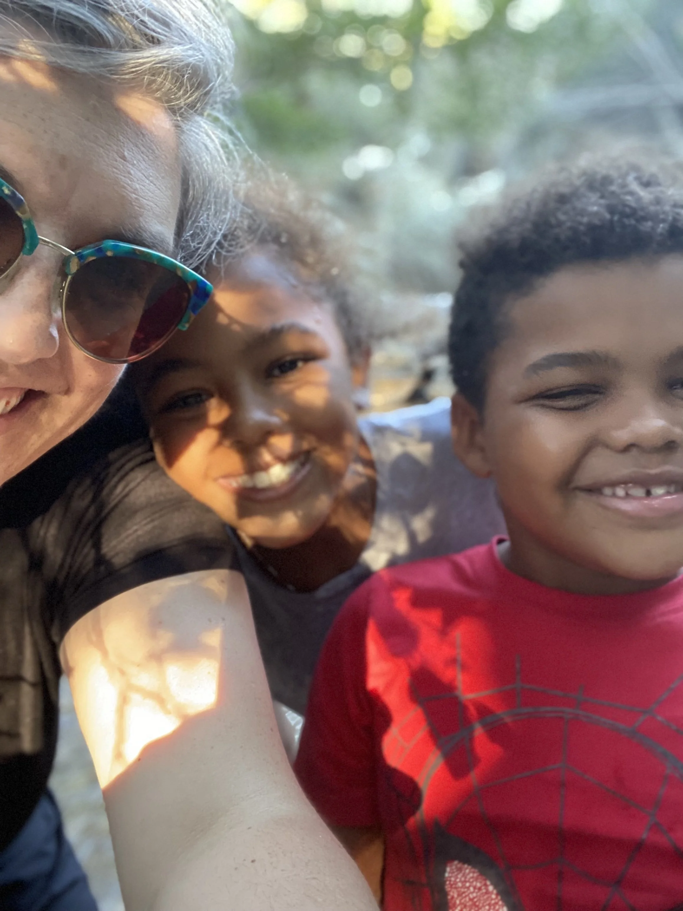 Amanda Gormley with her children outdoors in Tucson, Arizona — reflecting the multicultural family perspective she brings to her counseling practice.
