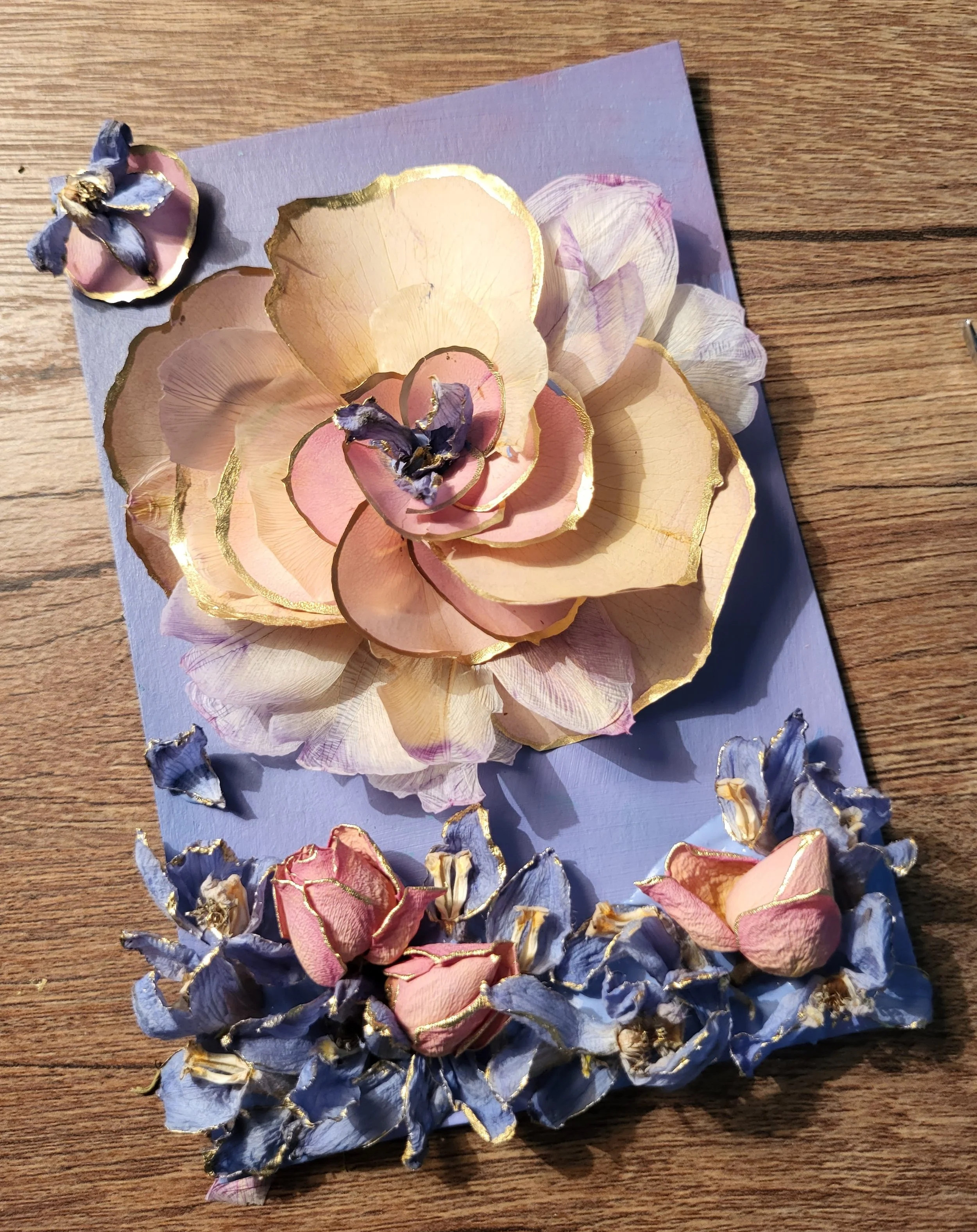 acrylic painting decorated with dried flowers