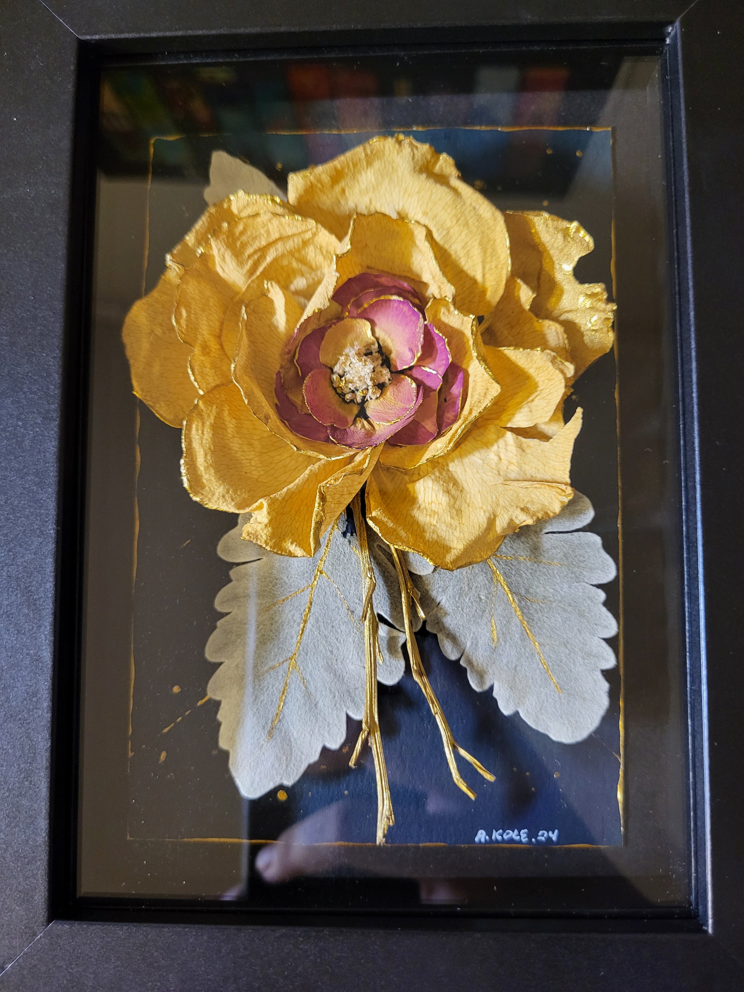 acrylic painting decorated with flowers and framed in shadow box