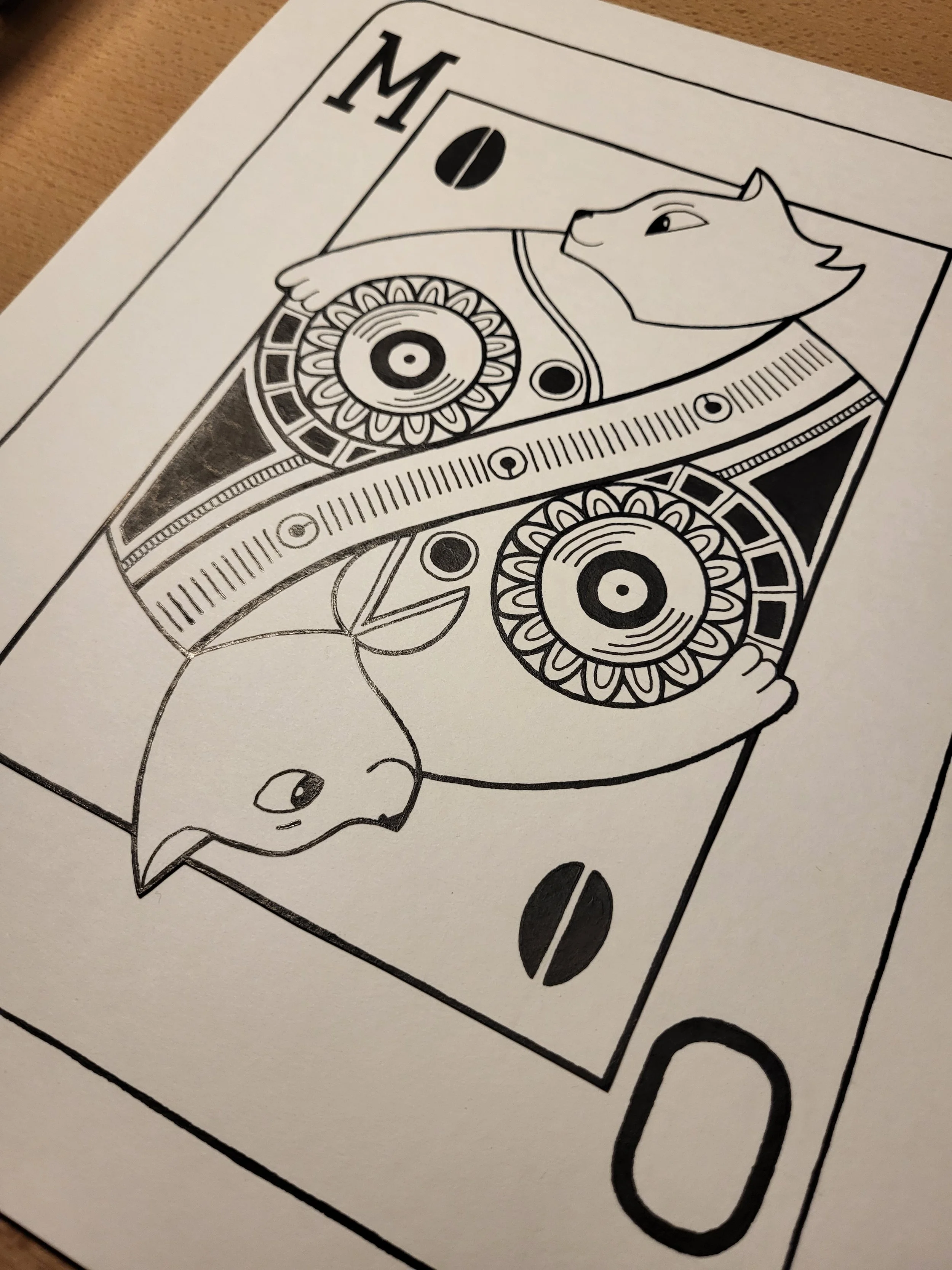 reversed view of inked card design with cats instead of kings