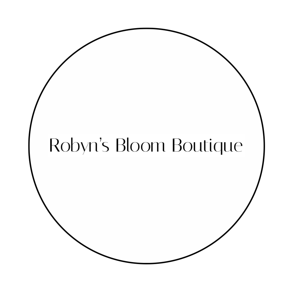Logo for Robyn's Bloom Boutique with black text inside a black circle on a white background.