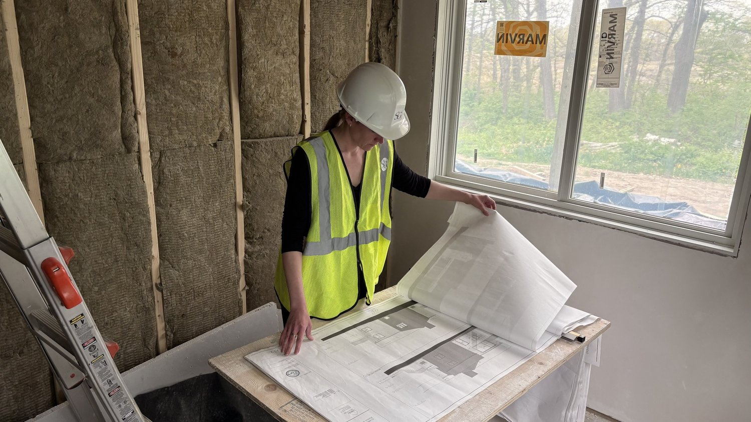 Samantha Grace reviewing plans on site
