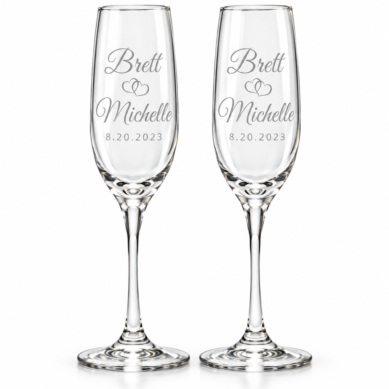 Personalized champagne flute set of 2 with first names, interlocking hearts, and engraved wedding date