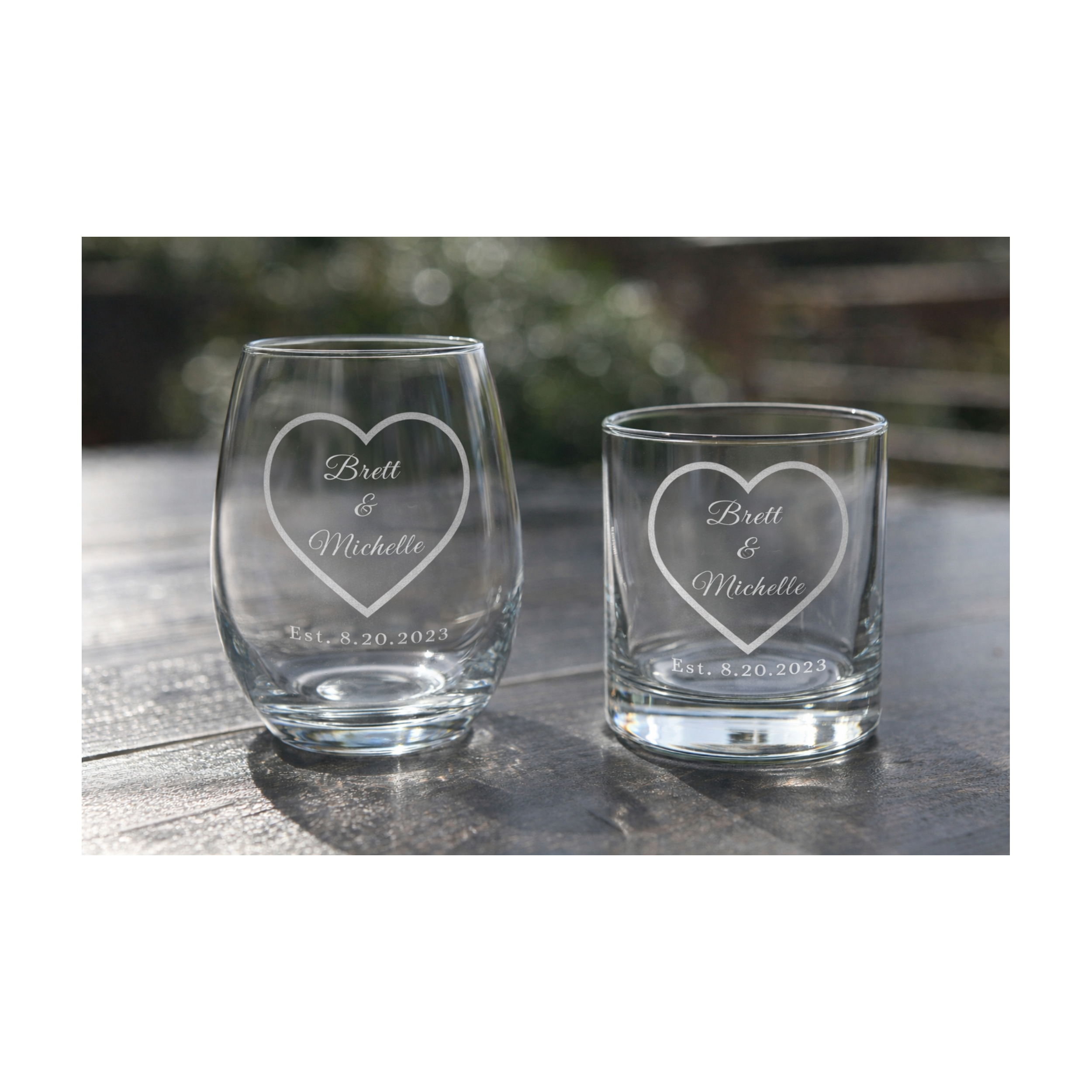 Personalized champagne flutes, stemless wine, and rocks glass with heart design, names and established wedding date engraving
