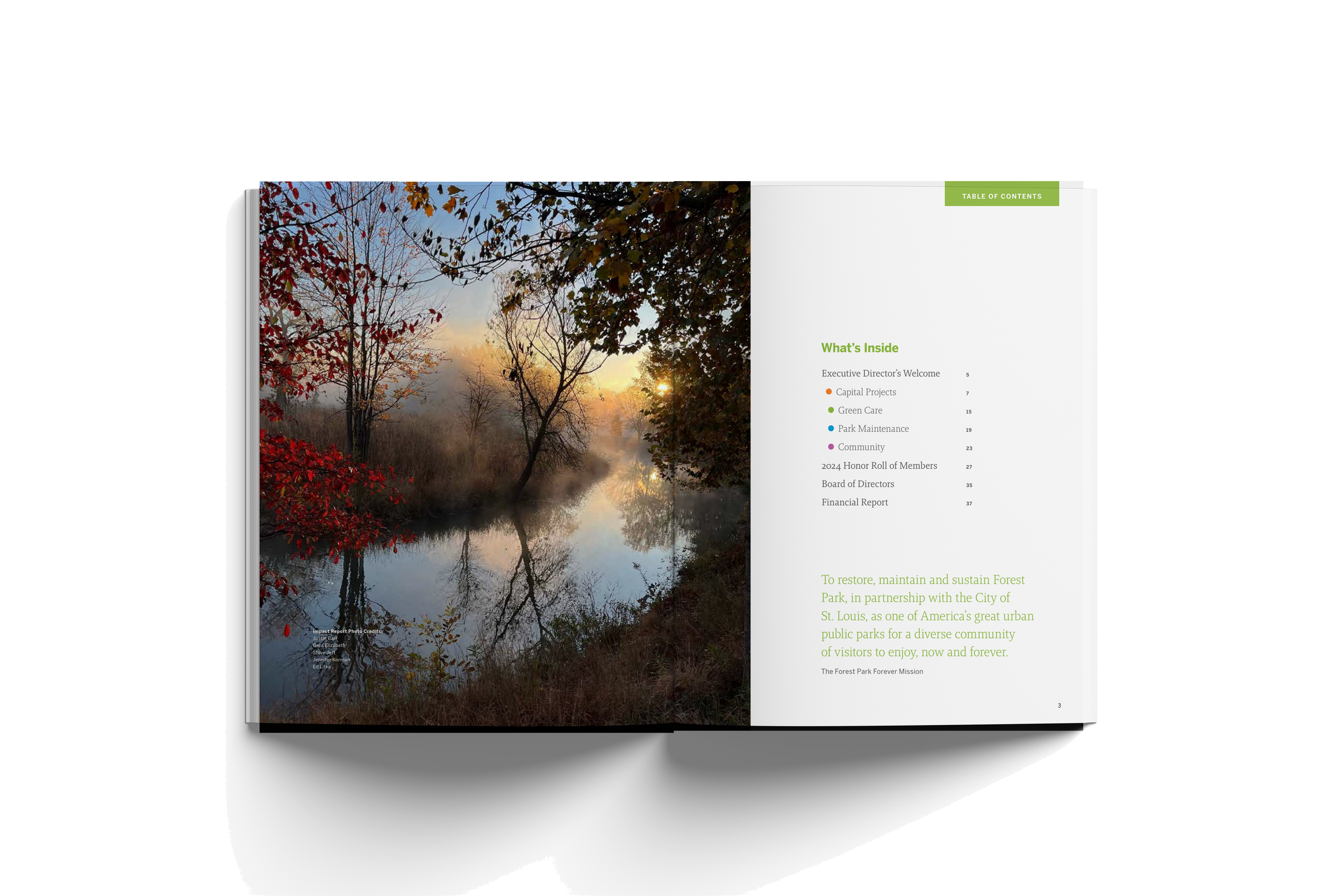 Open book with a two-page spread. Left page features a photograph of a river in autumn with trees, some with red leaves, and the reflection of trees on the water. Right page has a table of contents and a mission statement for a forest park, with gree