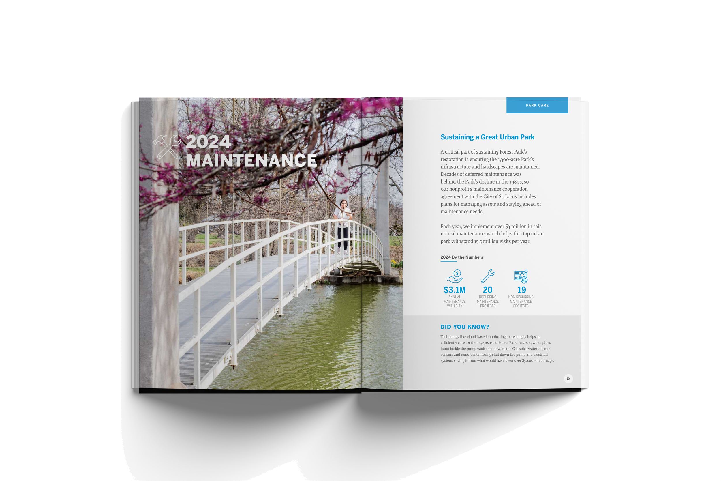 Open magazine with an image of a person on a white arched bridge over water, pink cherry blossoms in foreground, and text about forest park maintenance and sustainability.